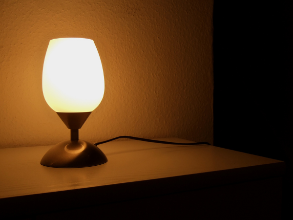 Woman sitting on a chair, facing the camera